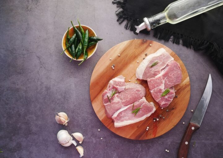 sliced meat on brown wooden chopping board